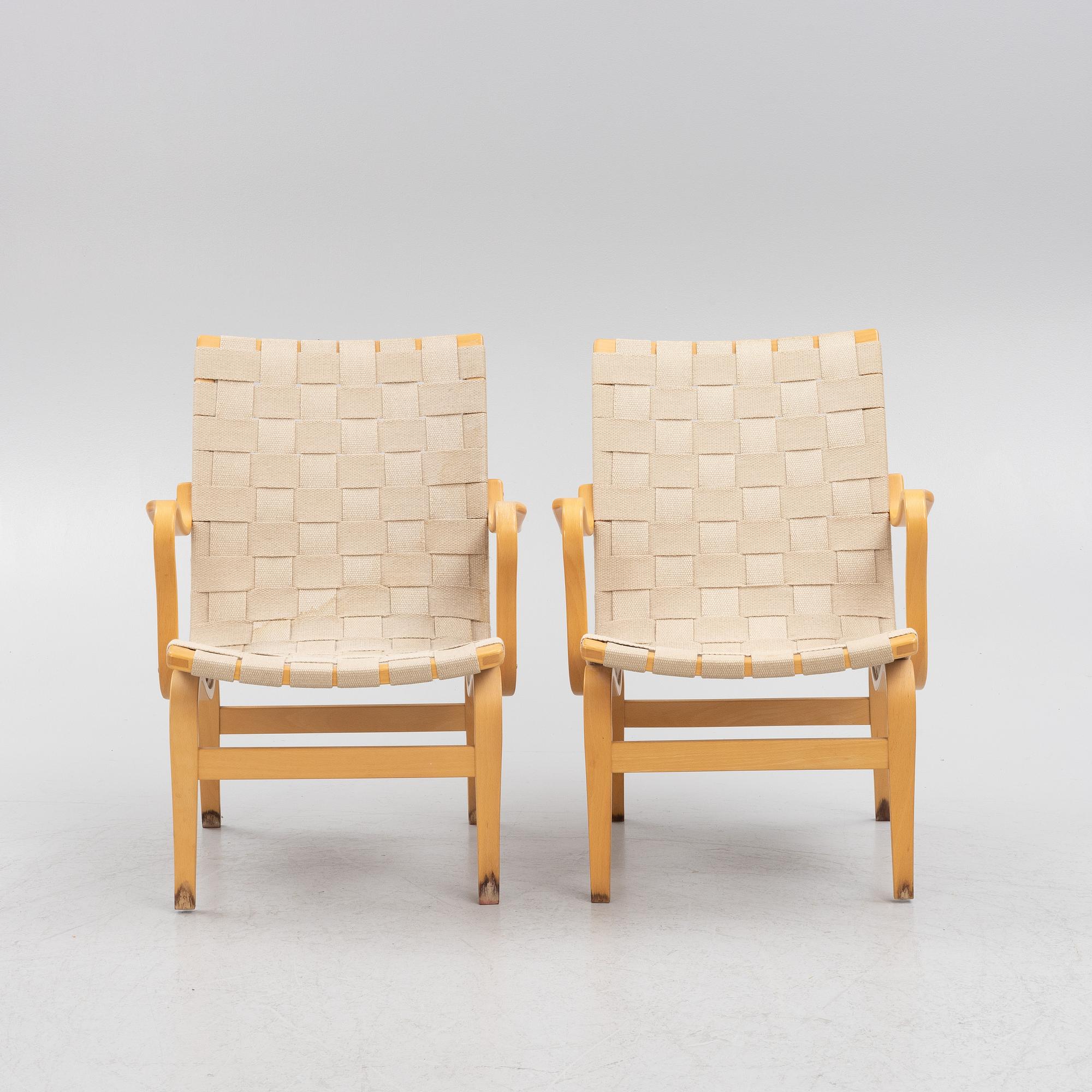 Bruno Mathsson, a pir of 'Eva' armchairs, Dux, late 20th century.
