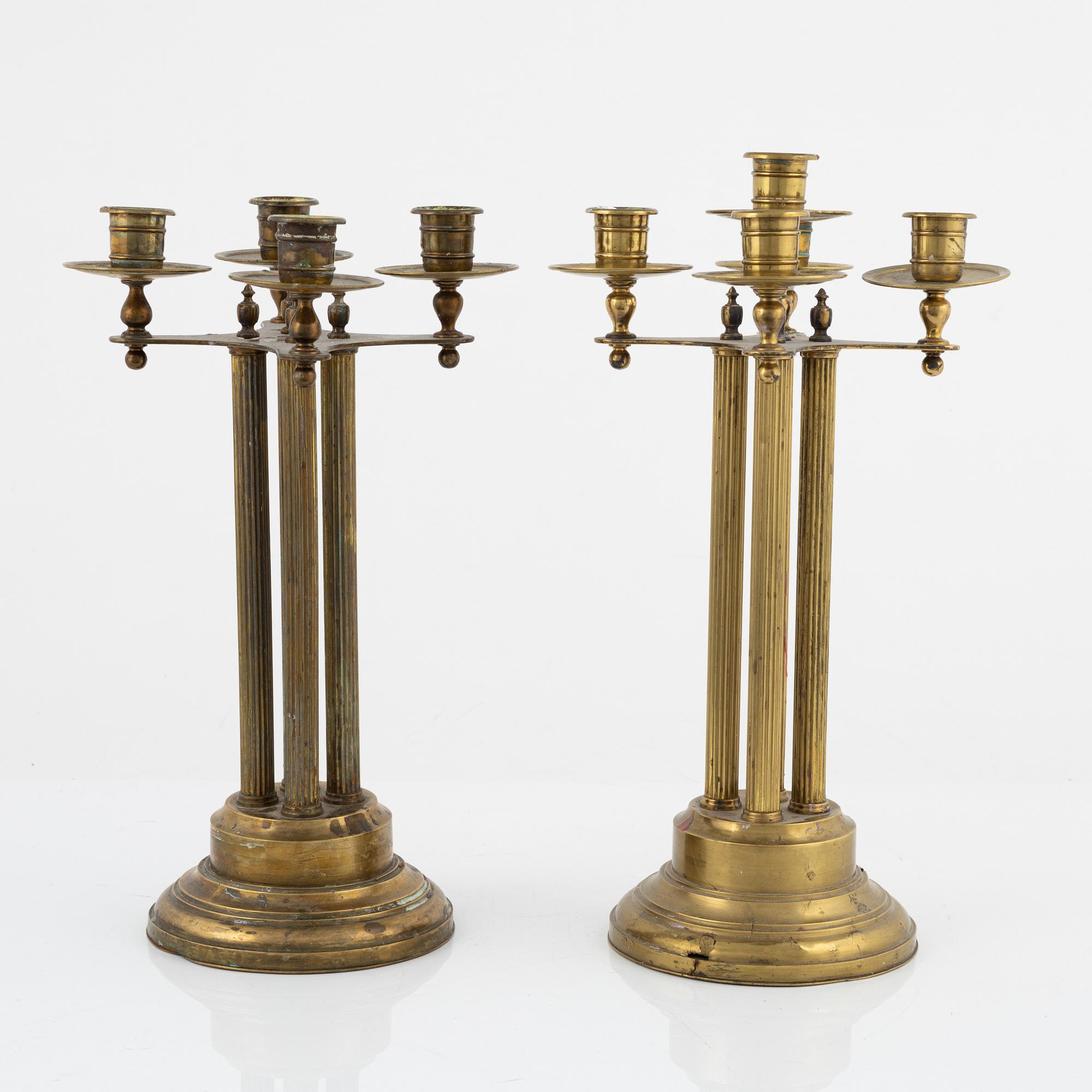 A pair of brass candelabras, first half of the 20th century.