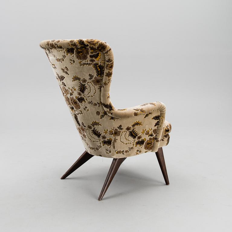 A mid-20th century armchair for Puunveisto Oy - Träsnideri Ab.