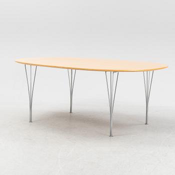 A 'Super elliptical' dining table by Bruno Mathsson & Piet Hein for Fritz Hansen.