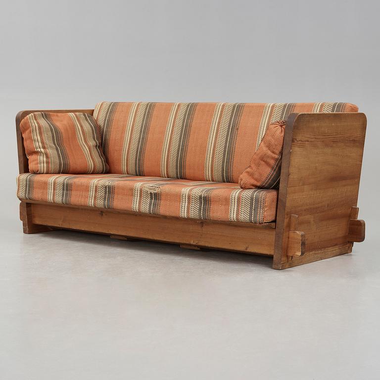 An Axel Einar Hjorth stained pine 'Lovö' sofa, Nordiska Kompaniet, Sweden ca 1930.