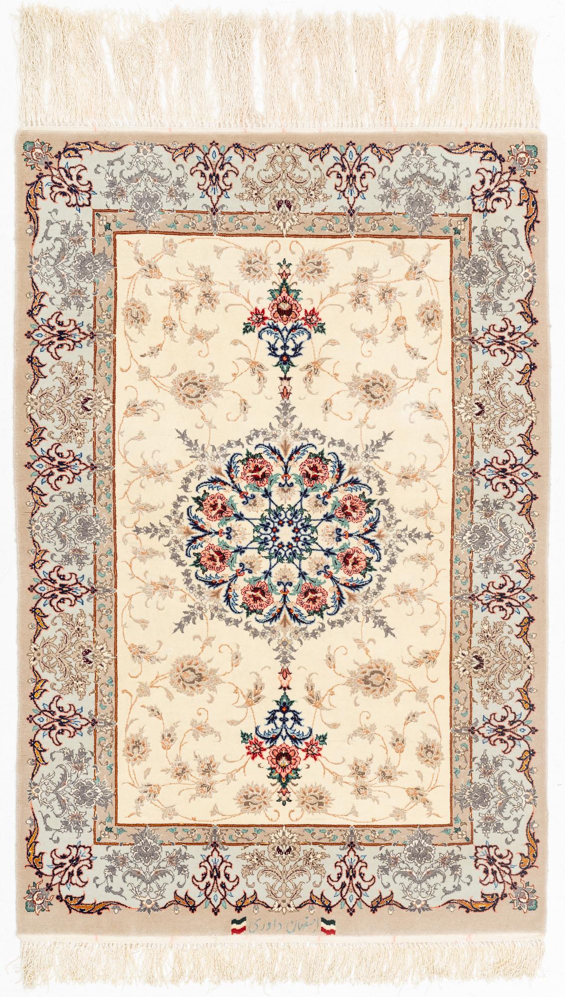 A part silk Isfahan rug, signed, c. 125 x 84 cm.
