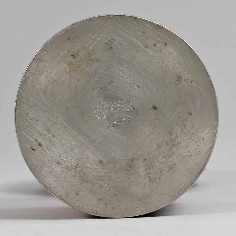 A 1920s pewter can with cover.