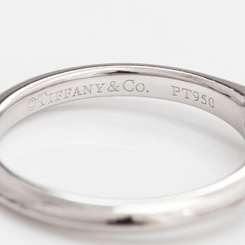 Tiffany & Co, A platinum ring with a ca. 0.26 ct diamond.