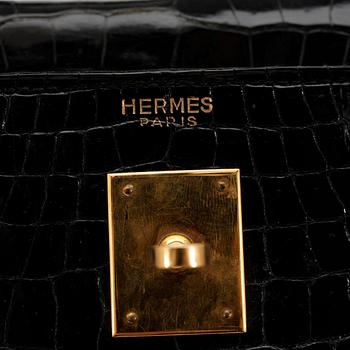HERMÈS, a black crocodile "Kelly 35" bag from the 1960s.