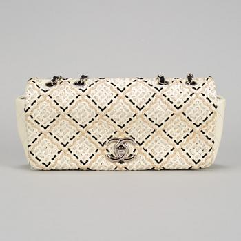 A white Chanel bag, 2010-2011.