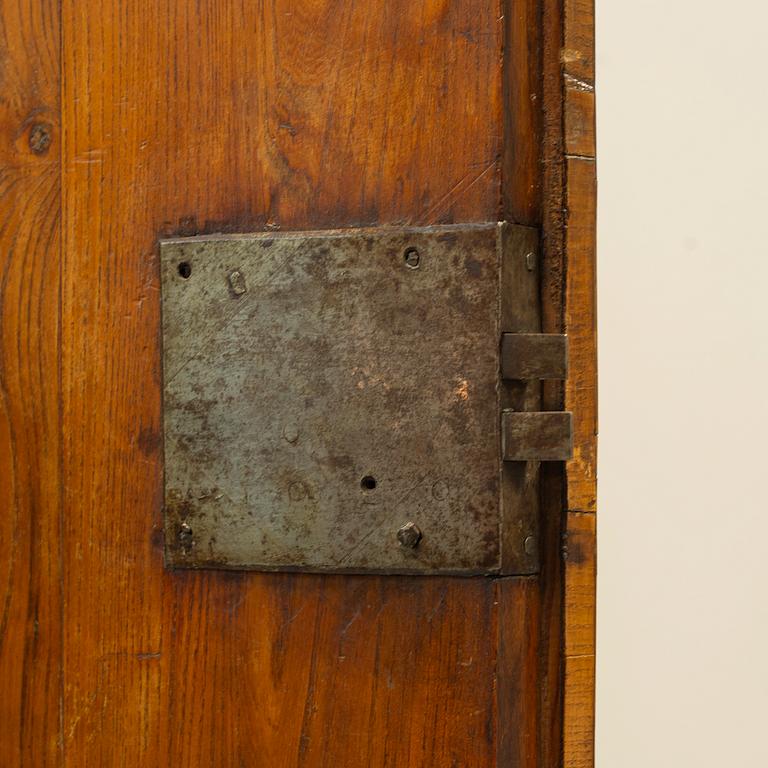 A Swedish elm and burr-elm rococo cabinet, later part of the 18th century.