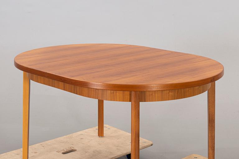 A mid 20th century teak dining table.