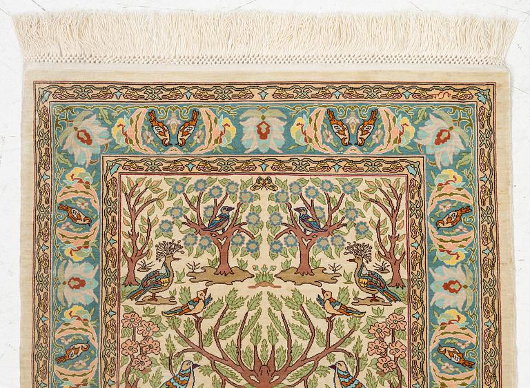 A figural silk Hereke rug, c 65 x 47 cm.