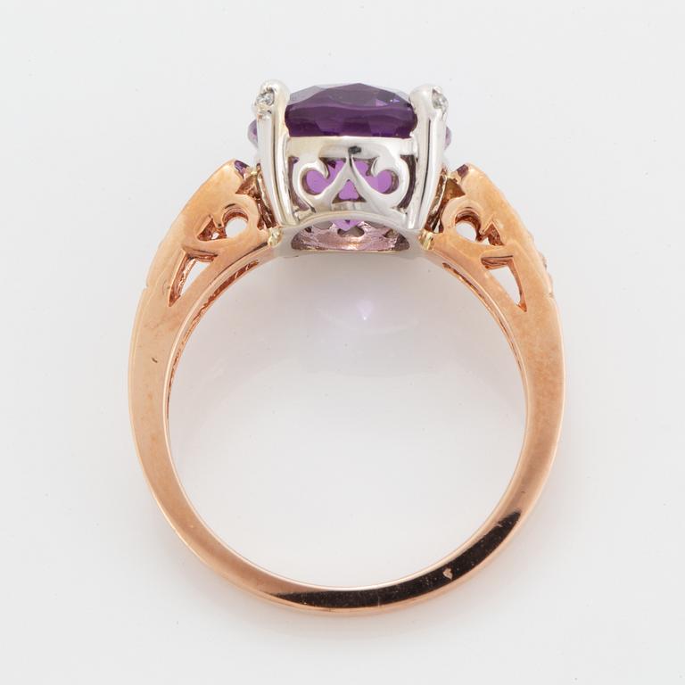 Oval faceted amethyst and brilliant-cut diamond ring.