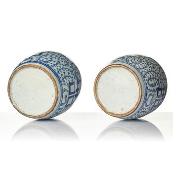 A pair of blue and white porcelain pots with covers, China, 19th century.