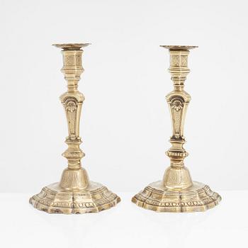 A pair of 18th century bronze candlesticks, Régence, France.