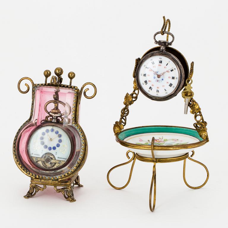 TWO POCKET WATCHES WITH STANDS.
