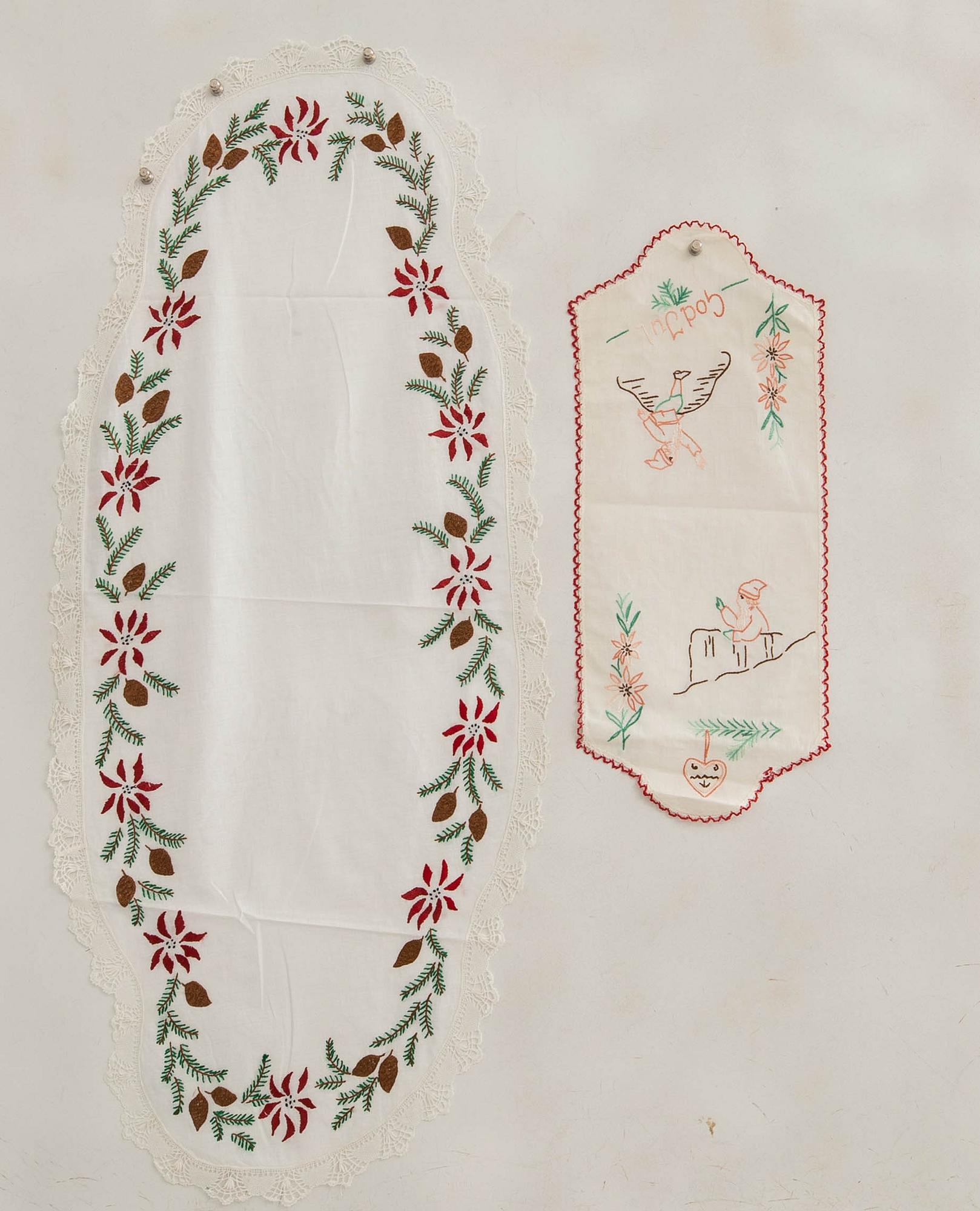 A collection of smaller Christmas tablecloths, runners, and wall hangings, approximately 34 pieces, mid/second half of the 20th century.