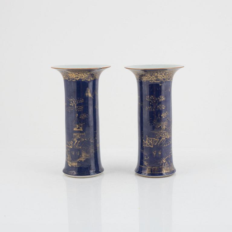 A pair of powder blue and gold 'trumpet' vases, Qing dynasty, 18th century.