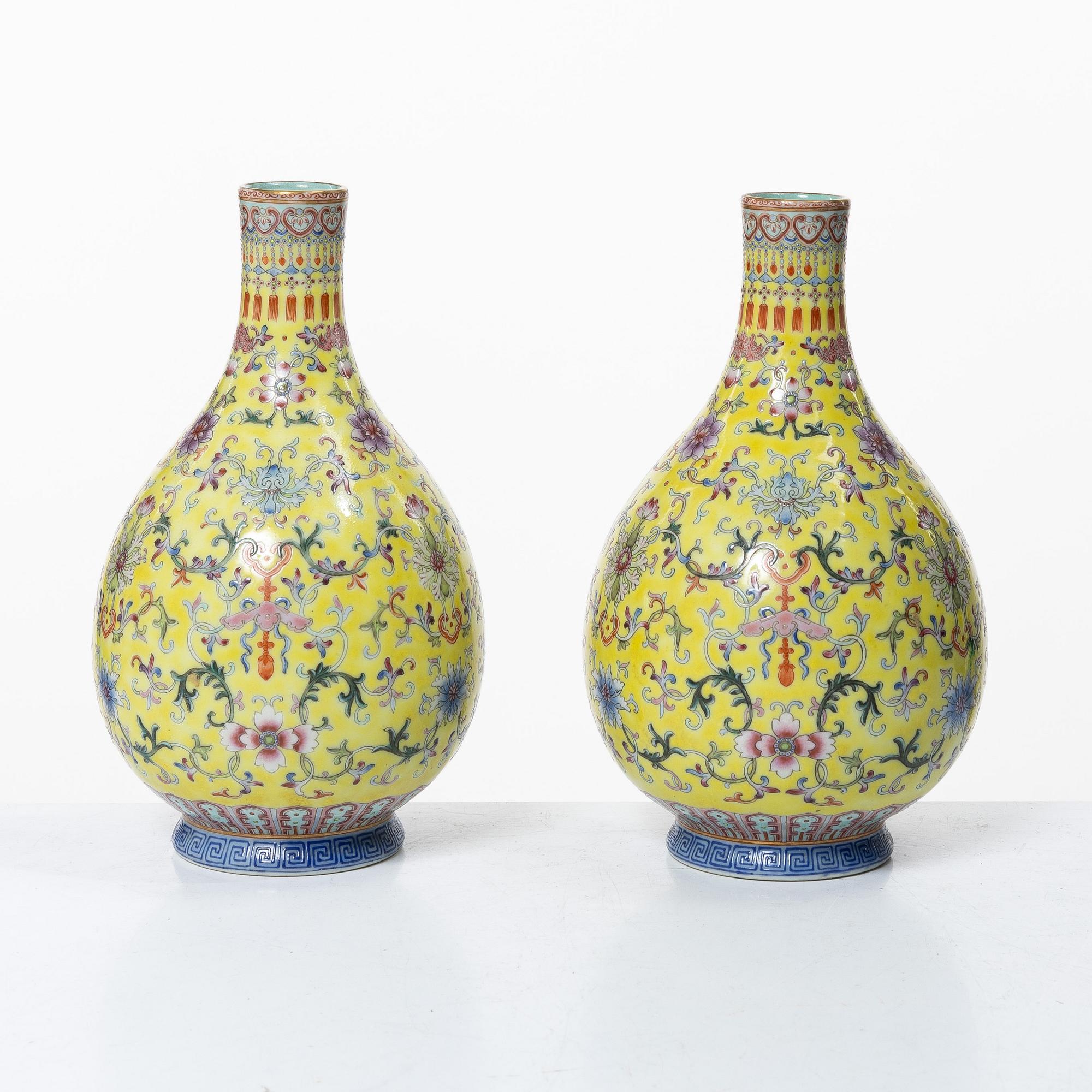 A pair of Chinese yellow ground porcelain vases, 1900s.