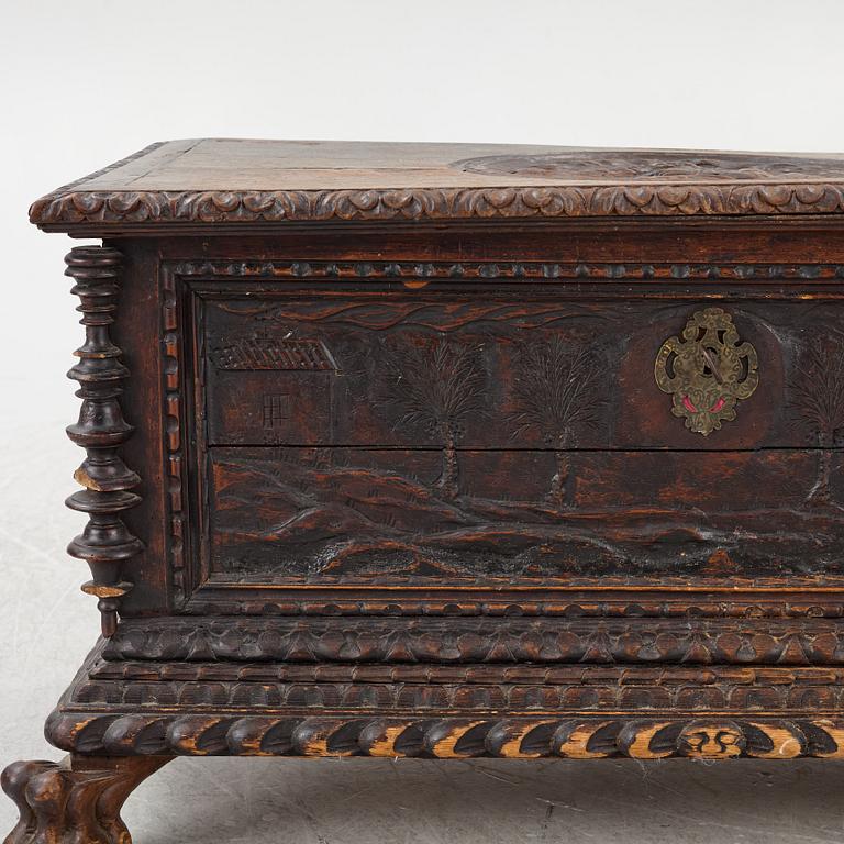 A baroque style wooden chest, 19th century.