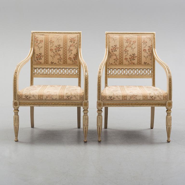 A pair of first half of the 19th century Empire arm chairs.