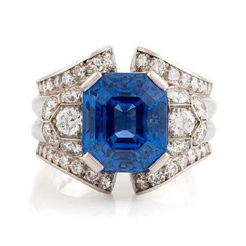 A WA Bolin platinum ring set with a faceted sapphire and old- and eight-cut diamonds.