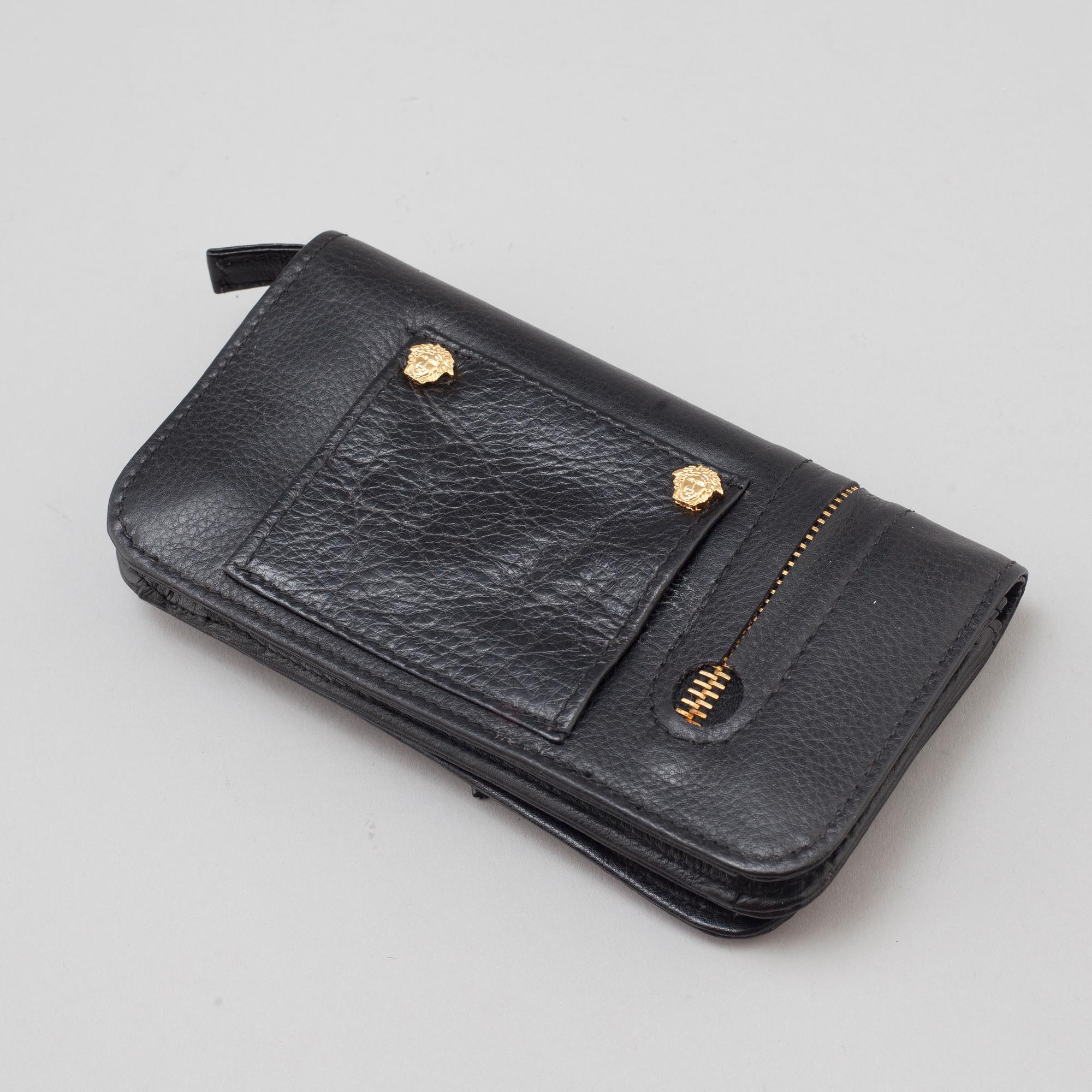 a VERSACE wallet.