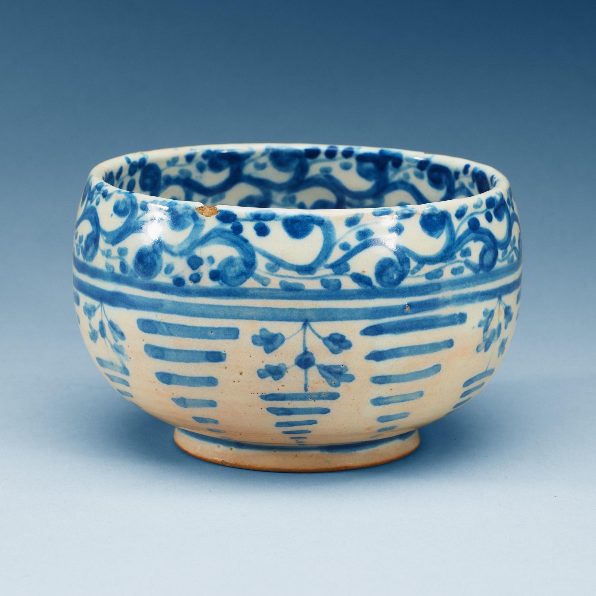 A Spanish faience blue and white bowl. Marked Talavera, presumably 18th Century.