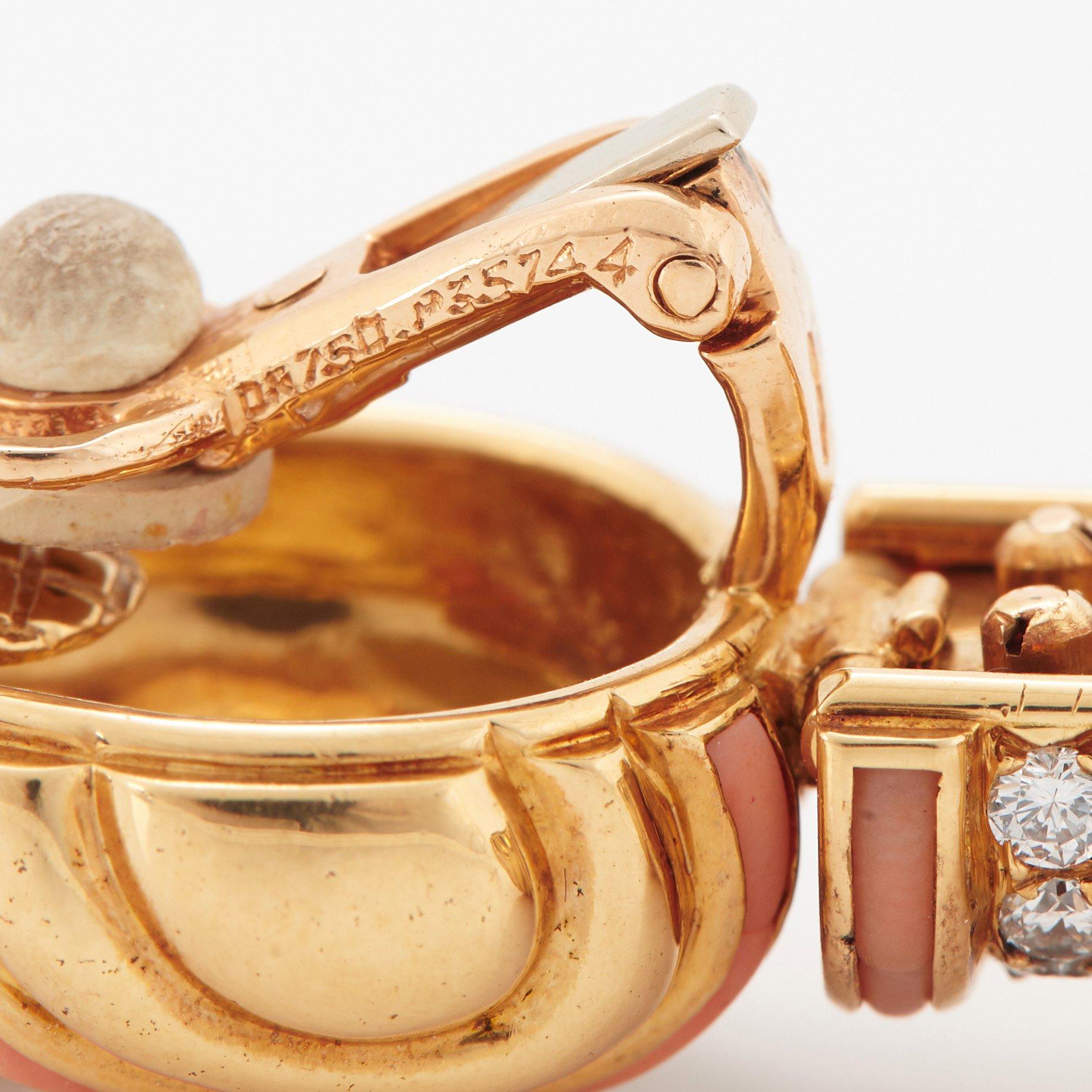 A pair of 18K gold Boucheron earrings set with round brilliant-cut diamonds and coral.