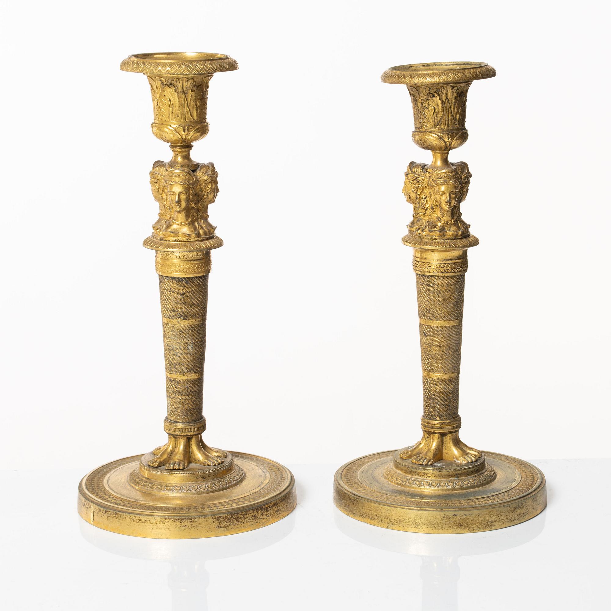 A matched pair of candlesticks, Empire, France, first half of the 20th century.