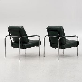 Gabriele Mucchi, a pair of steel and leather easy chairs, Zanotta, Italy, the model designed in 1983.