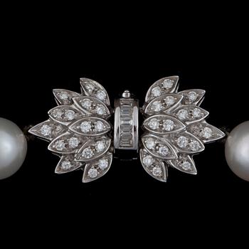 A cultured pearl necklace and earrings with diamonds. Pearls Ø 10 mm. Total carat weight of diamonds circa 1.20 cts.
