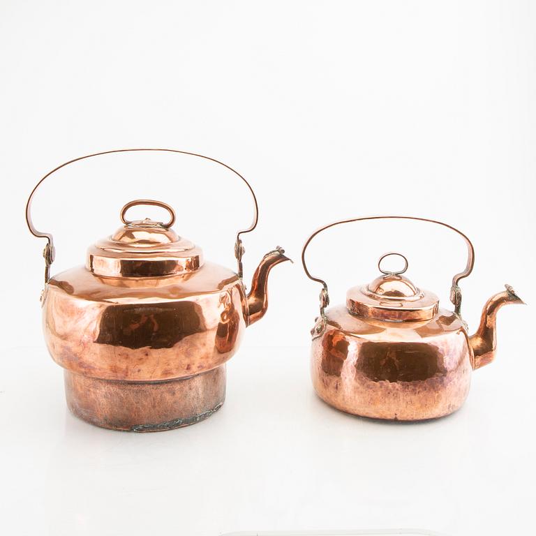 A pair of 19th century copper coffee pots.