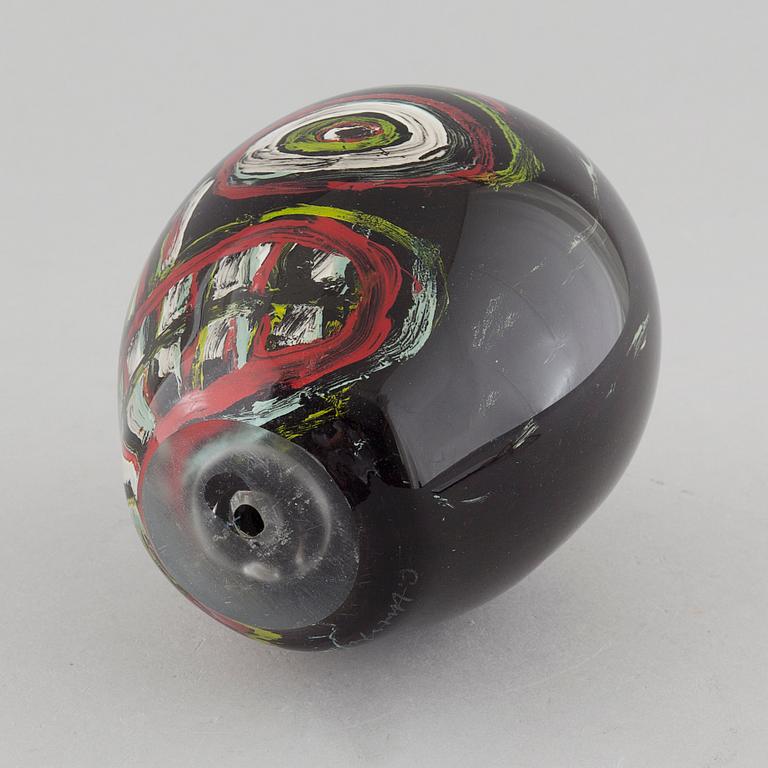 a glass object, signed.