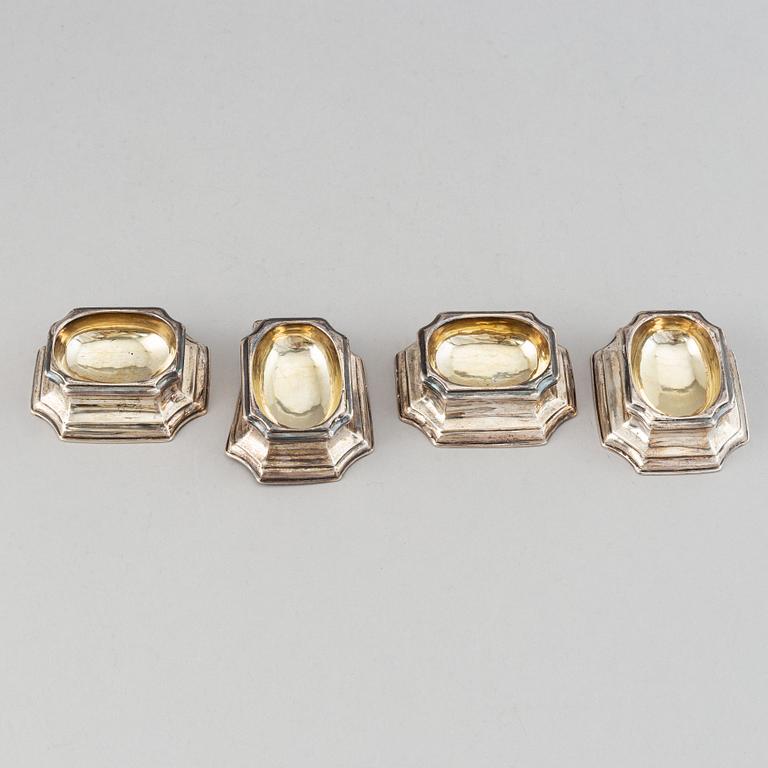 Four English early 18th century parcel-gilt silver salt-cellars, mark of Edward Wood, London 1727.