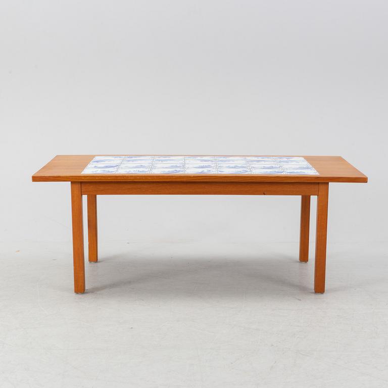 A teak coffee table with inlaid tiles. Second half of the 20th Century.