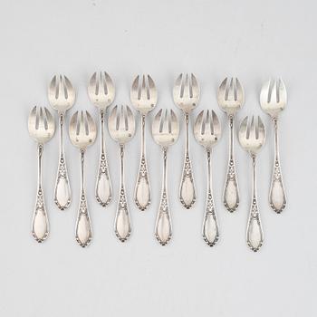 A set of twelve French late 19th / early 20th century silver oyster forks.