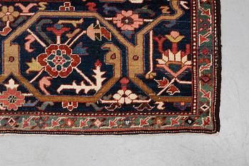 A carpet, antique Heriz, a so-called Serapi, ca 360 x 321 cm.