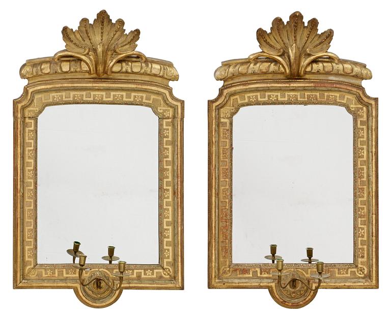 A pair of Gustavian two-light girandole mirrors.