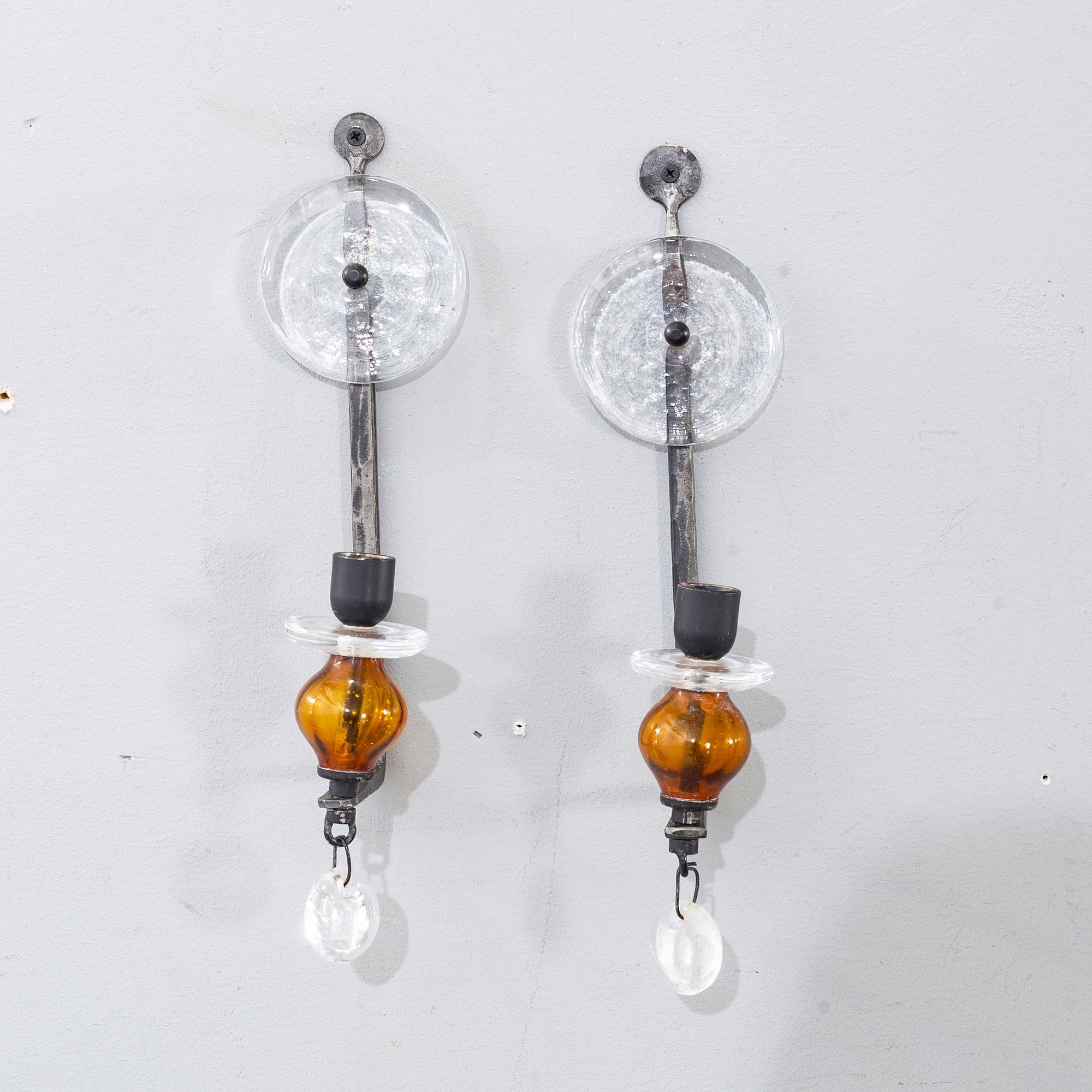 ERIK HÖGLUND,A pair of wall candle holders and a chandelier, kosta Boda, second half of the 20th century.