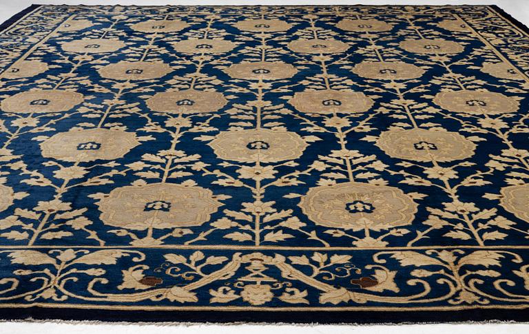 An antique Peking carpet, north China, c. 438 x 373 cm.
