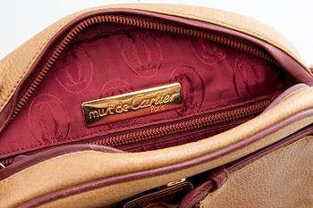 A HANDBAG, Cartier.