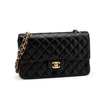 CHANEL, a quilted black leather "Double Flap" shoulder bag.