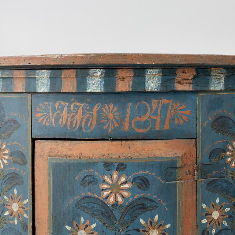 A folk art corner cabinet from Delsbo, Hälsingland dated 1847.