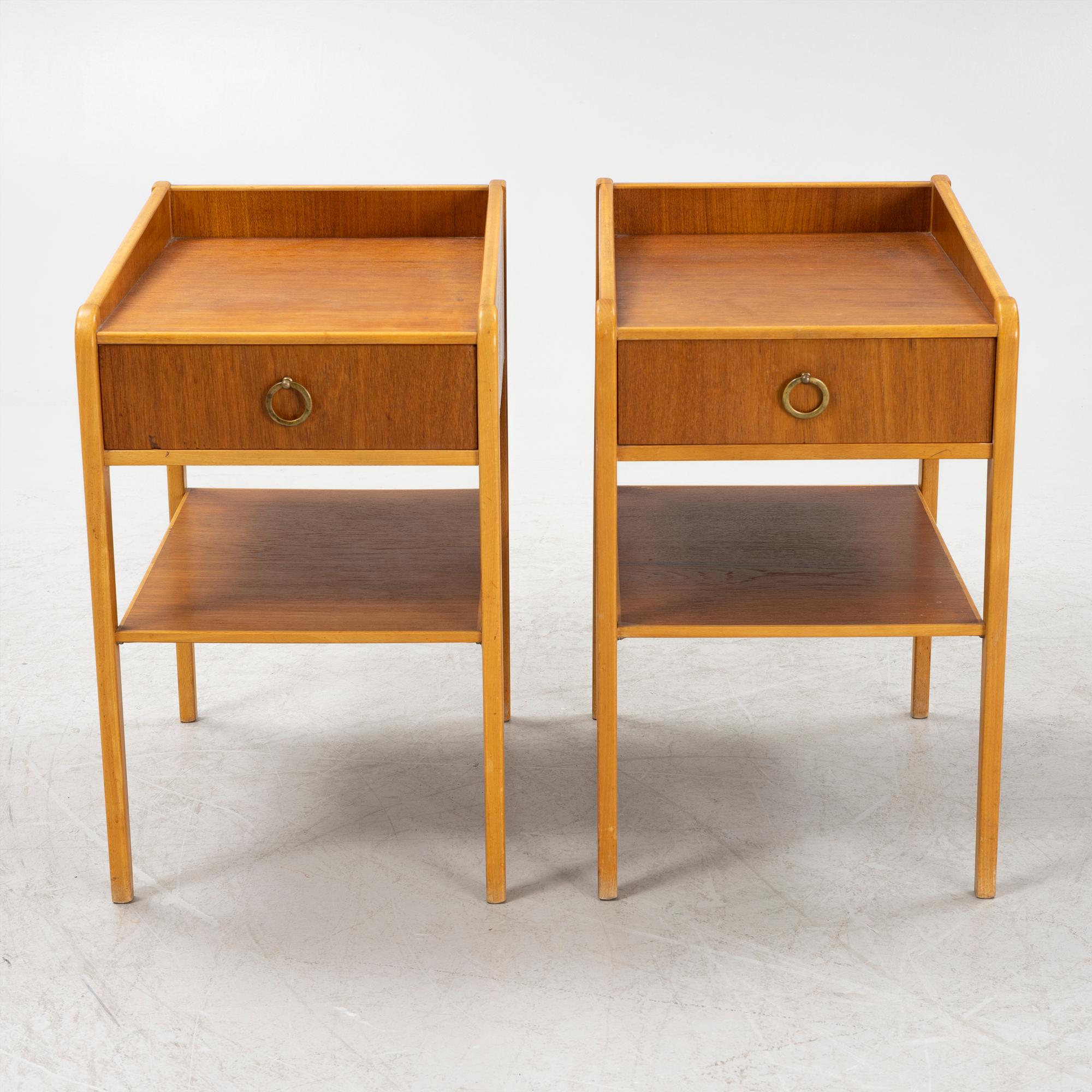 A pair of teak veneered bedside table, mid 20th Century.