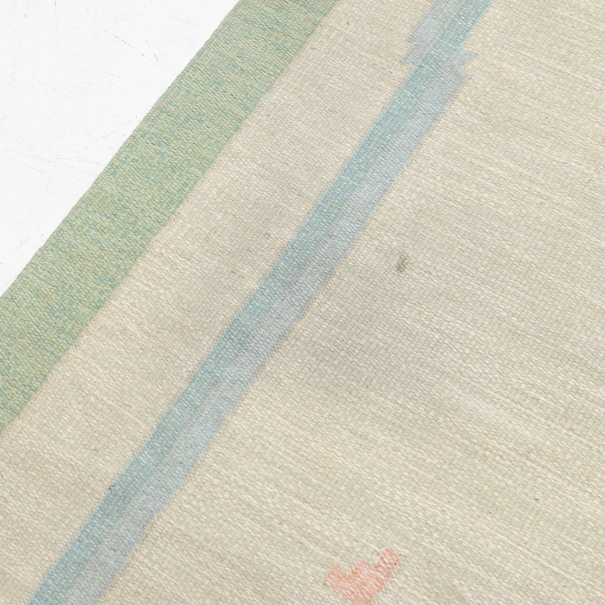 A flat weave carpet, signed PIA, c. 244 x 163 cm.