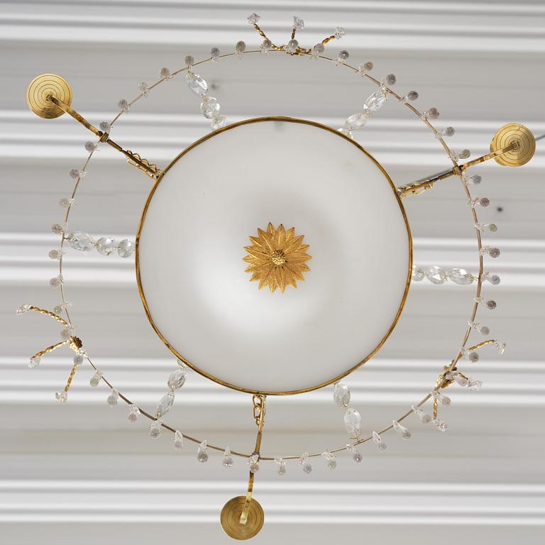 A late Gustavian gilt brass and cut glass four-light chandelier, Stockholm, late 18th century.