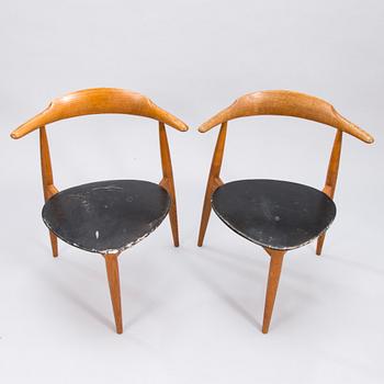 A pair of "Hjertestolen" by Hans J Wegner produced for Fritz Hansen.