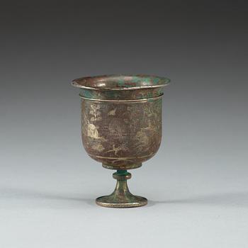 A silver stem cup with hunting scenes, presumably Tang dynasty.