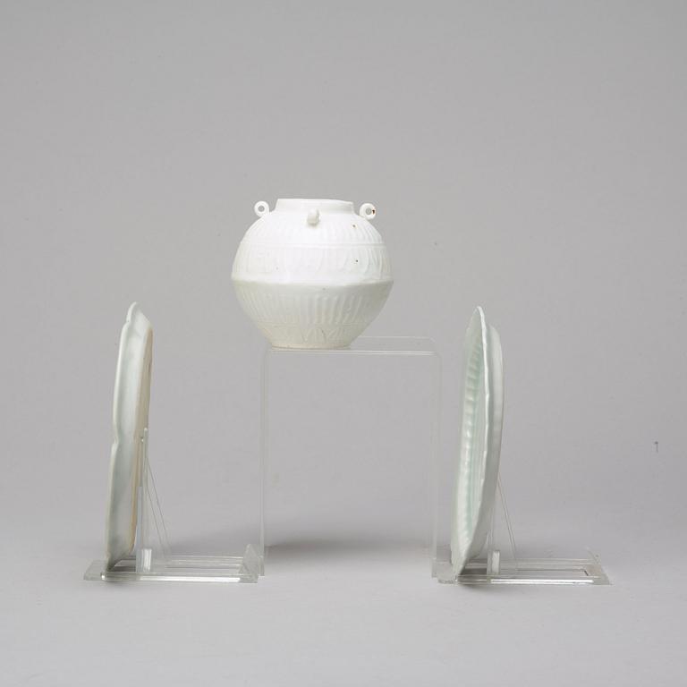 Two celadon glazed dishes and a white glazed jar, South East Asia, presumably 12th/17th Century.
