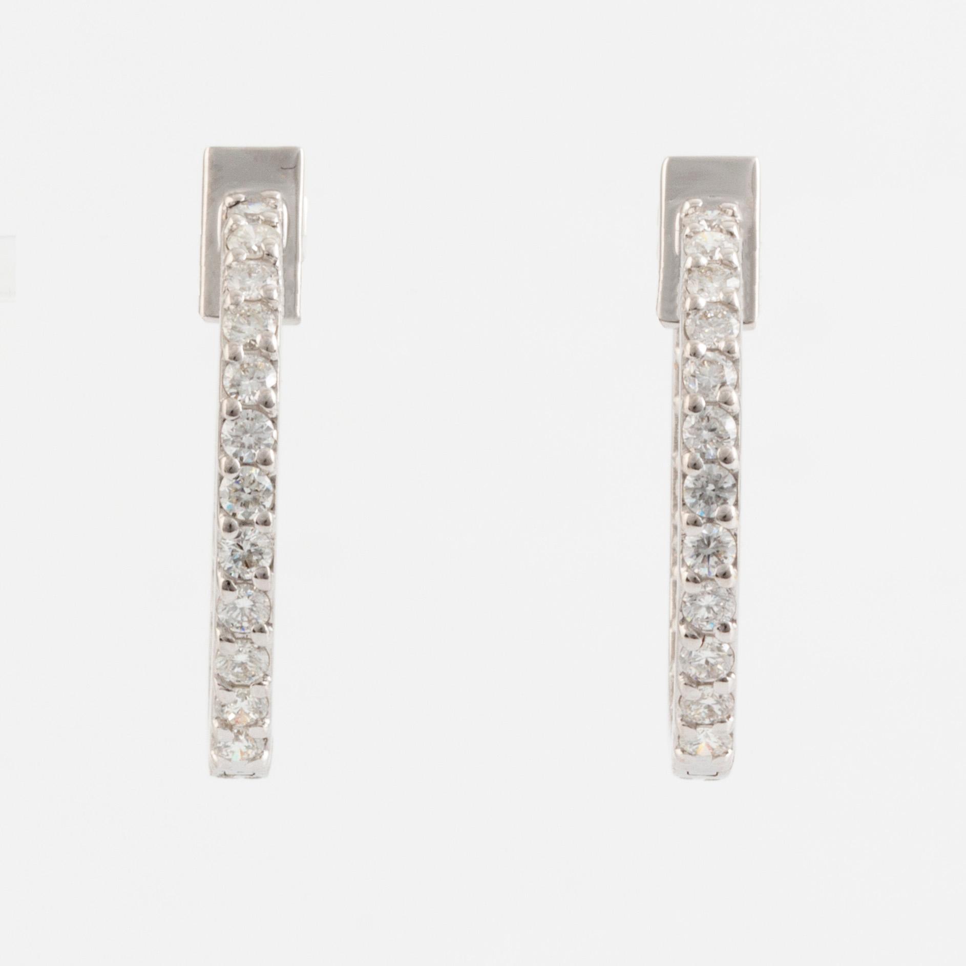 Brilliant cut diamond hoop earrings.