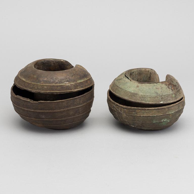 Two bronze currency braclets, Baule, Ivory Coast.