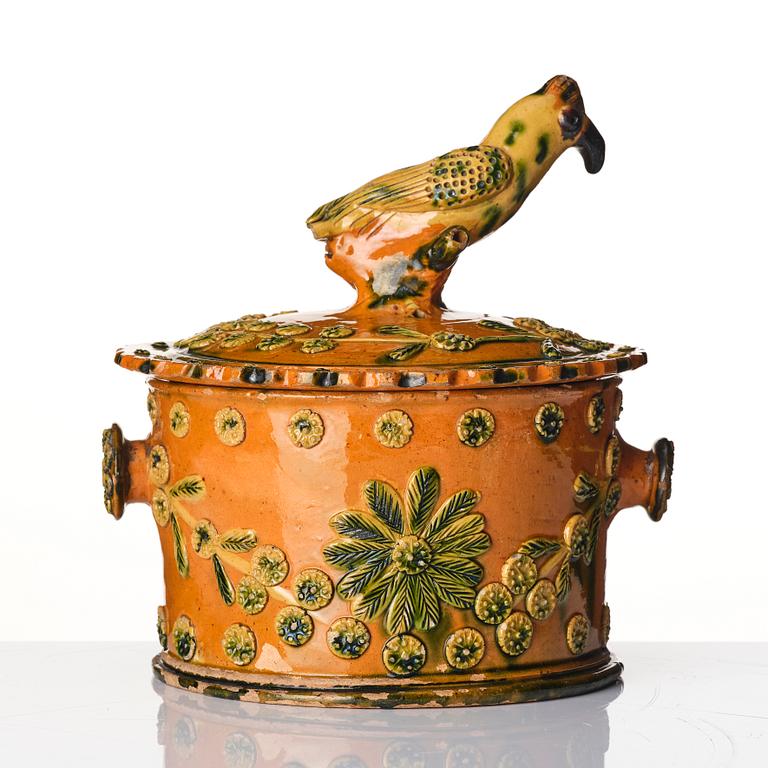 A glazed earthenware jar with cover, probably France, 19th century.